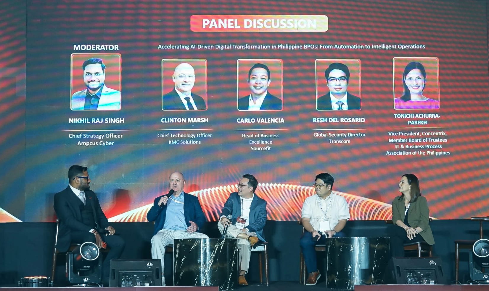 Industry leaders sharing insights at a conference